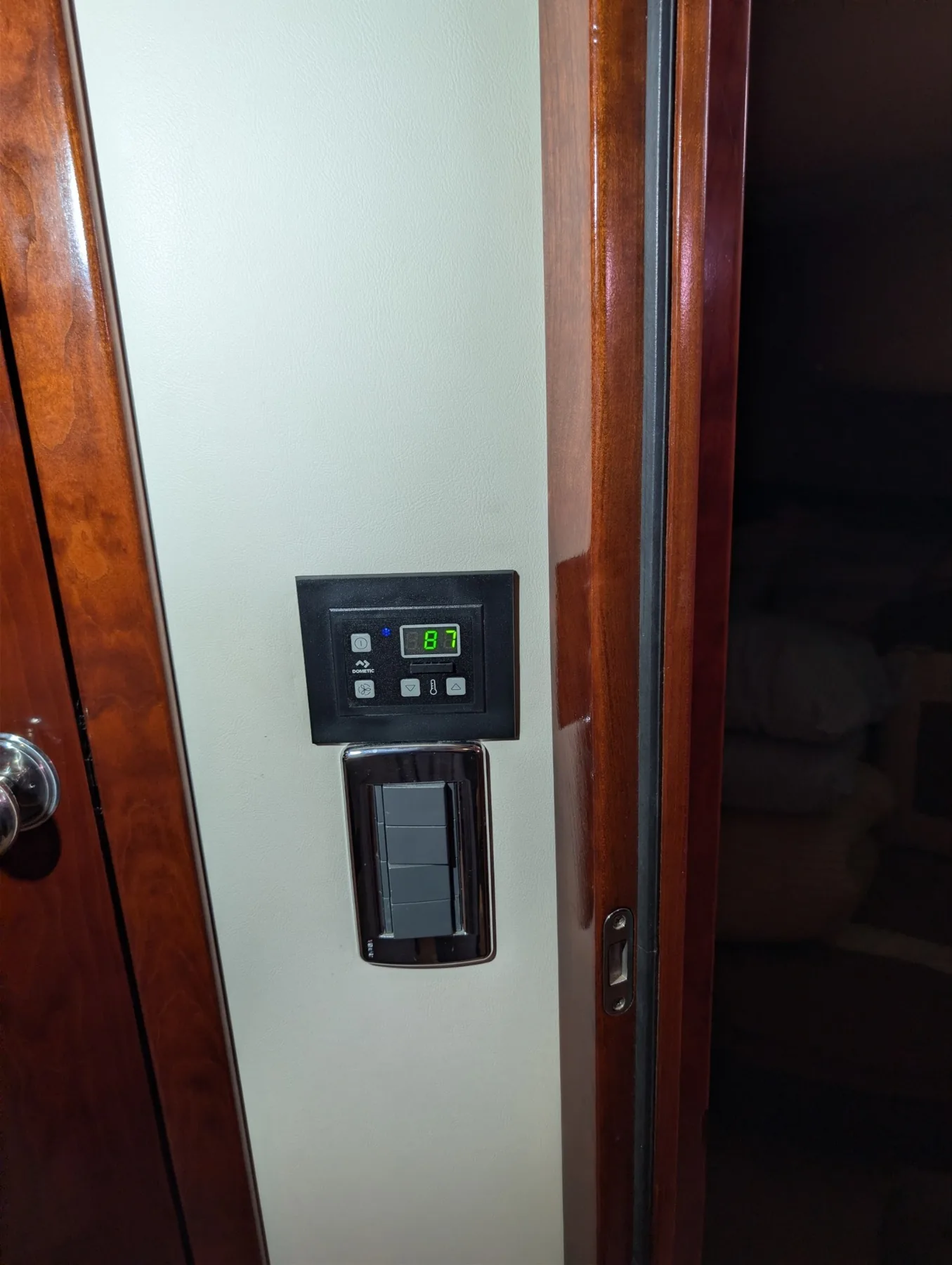 Wall-mounted Dometic marine air-conditioning control with active temperature display