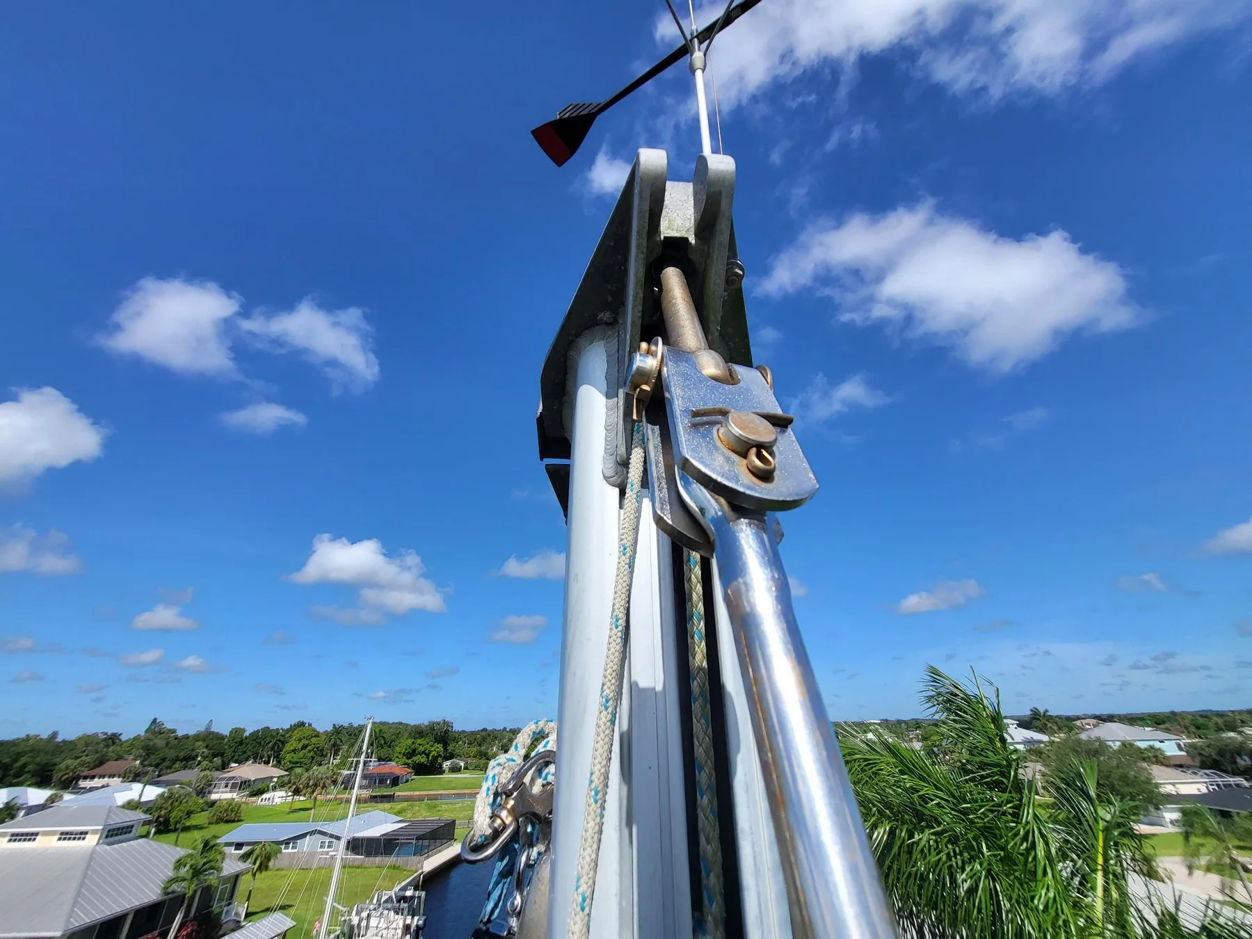 Sailboat masthead stay attachment with toggle, clevis pin, and halyard sheave